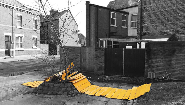 Photo of orange-painted flooring by the side of a road