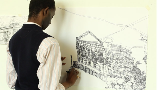 The artist Leslie Thompson working on a drawing of a building