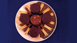 Plate of biscuits - bourbons, custard creams, jaffa cakes - arranged artistically