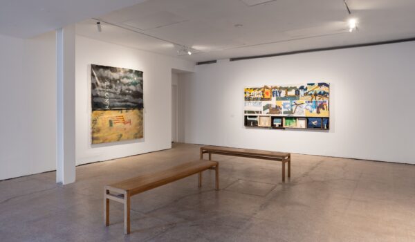 Interior of Castlefield Gallery, white walls and concrete floors. featuring collage artwork by Joe O'Rourke.