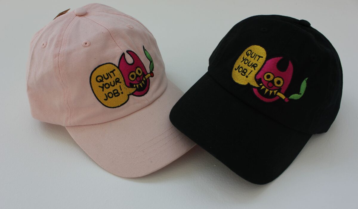 One pink cap and one black cap next to each other against white background.